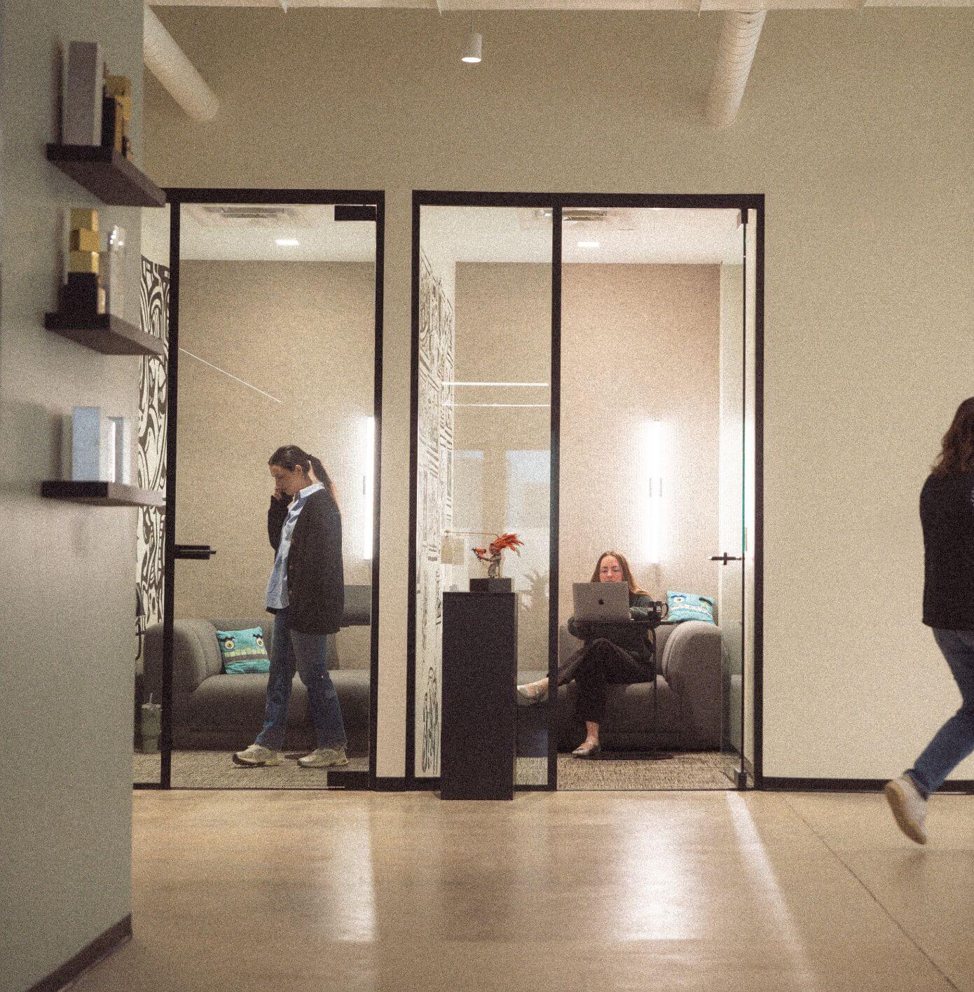 Team members utilizing the smaller meeting rooms